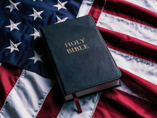 Faith and Nation: Exploring the Intersection of Christianity and Patriotism. Christianity and Patriotism concept. The holy Bible laying on a red white and blue american flag.