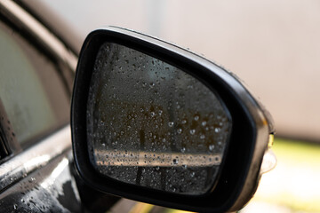 man washes his car at the car wash