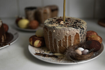 easter cake with chocolate and eggs on a white plate