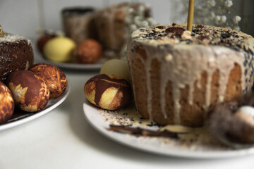 easter cake with chocolate and eggs on a white plate