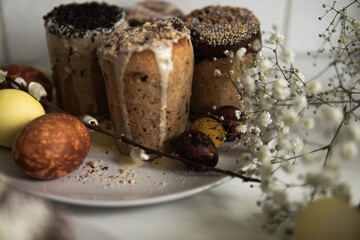 easter cake with chocolate and eggs on a white plate