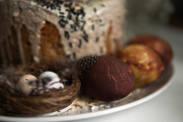easter cake with chocolate and eggs on a white plate