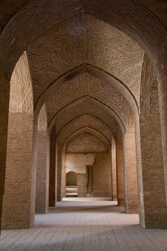 A very large interior with architectural columns with Islamic architecture known as Shabestan in Jame Atiq Mosque in Isfahan city (efahan), Iran