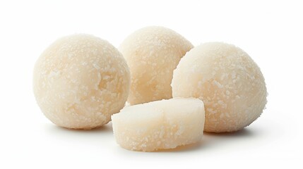 Four white balls made of mochi, a Japanese rice cake, on a white background.