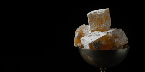 Eastern sweetness Turkish delight on a black background
