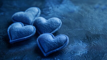 Beautiful felt hearts of blue color on a dark blue concrete background It can be used as a background : Generative AI
