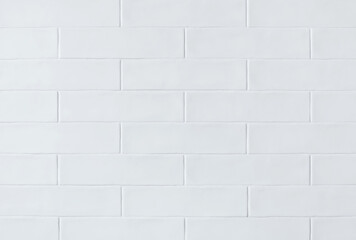 White light brick tiles wall texture wide background in rustic style. Structure and pattern of...