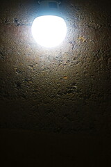  Rammed earth wall with light bulb