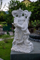 Obraz premium stone musician statue