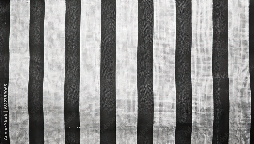 Poster a black fabric with a pattern of lines and swirls. the fabric is wrinkled and he is old