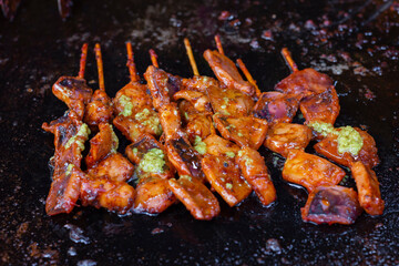Cooking process of squid satay at food corner