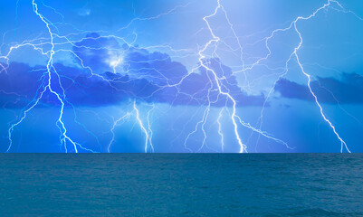 Beautiful landscape with lightning over the calm sea 