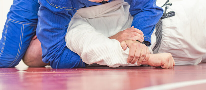 Jiujitsu martial arts training, Gi kimono grappling, copy space selective focus image
