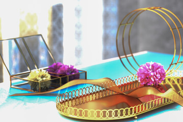 Modern Showcase Platform. reflective gold podium adorned with colorful blooms. Ambient light...