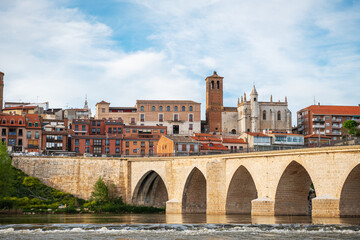 Panorama view of the medieval bridge and city of Tordesillas in Valladolid by the Douro River.