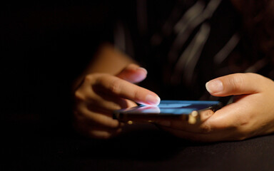 Woman hand scrolling on smartphone