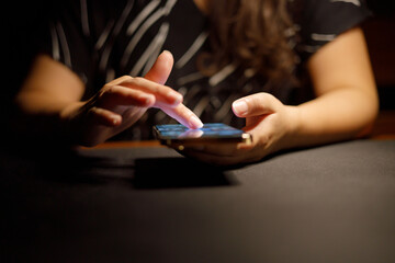 Woman hand scrolling on smartphone