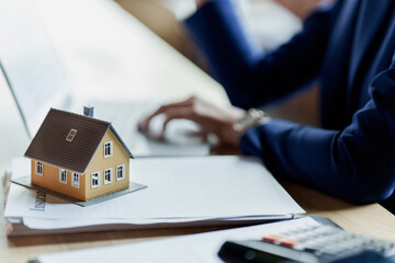 Real estate agent broker with loan or insurance contract documents..