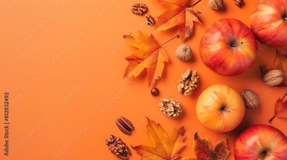 Poster Autumn flat lay with bright colorful maple leaves  with apple and nuts on orange background Top view and copy  space : Generative AI