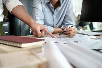 Engineer or interior Architects designer construction plans on blueprint