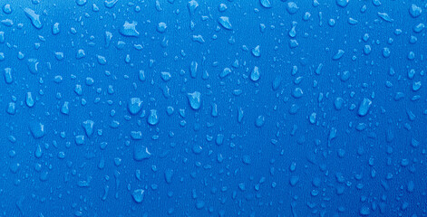 blue plastic texture with water drops for background