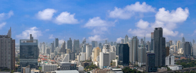 Fototapeta premium Panorama aerial view of downtown urban area of Bangkok with blue sky for cityscape and development concept