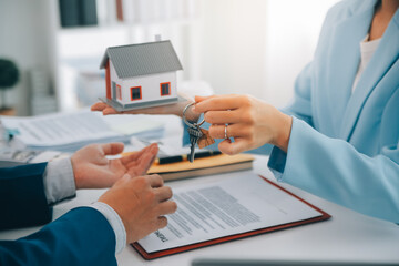 Real estate agent talked about the terms of the home purchase agreement and asked the customer to...