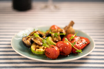 Mix of grilled vegetables served on a plate in a restaurant