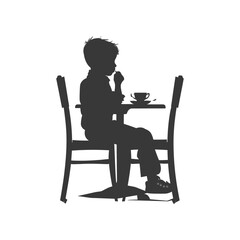 Silhouette little boy sitting at a table in the cafe black color only