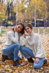 Fashion portrait of two girlfriends