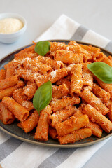 Homemade Vodka Rigatoni Pasta with Parmesan and Basil, side view.