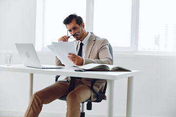 Document paper laptop happy holding confident planning company professional businessman office suit
