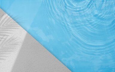 Blue swimming poolside and cement floor with light shadow leaves well summer season presentation on...