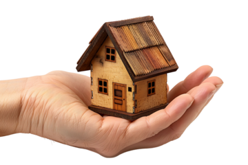 Hand holding a small simple house on isolated transparent background