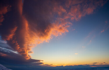 sunset color and shape of clouds resembling a fire in the sky