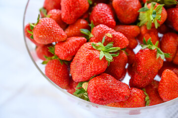 Large red strawberries in a plate