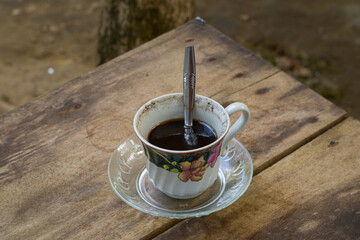 Coffee cup on wooden table, drinking coffee