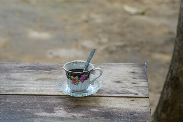 Coffee cup on wooden table, drinking coffee