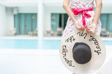 In the lap of luxury, a young Asian traveler relishes her holiday at a prestigious hotel, spending...