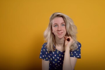 Smiling Young Woman in Patterned Top on Yellow Background. Generative AI.