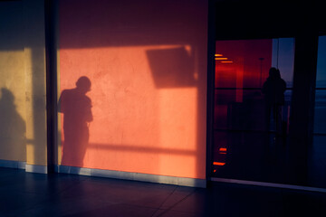An abstract image from the shadow of a man. Their human outlines can be seen on the textured...