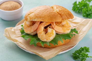 Deep fried squid in bread with greens on the side. Squid sandwich