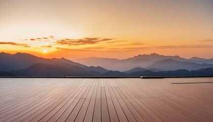 A wide flat roof top with a background of sunset and mountains