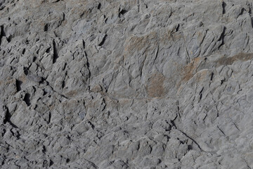 Stone texture worn by the wind and the sea of ​​the coast located on a wild beach.