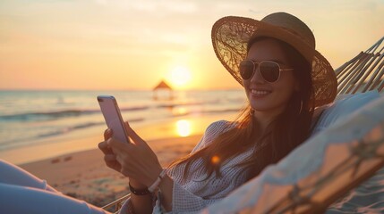 Working remotely Young happy woman female freelancer in straw hat and sunglasses working on smartphone while relaxing in the hammock on the beach at sunset Distance job during vacation : Generative AI