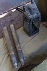 St. Petersburg, Russia, May 9, 2024. Wartime cannon shells next to a kerosene lamp.                               