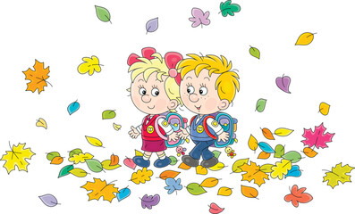 Happy little schoolboy and schoolgirl with their schoolbags going to school through flying and falling colorful autumn leaves to the start of classes, vector cartoon illustration on white