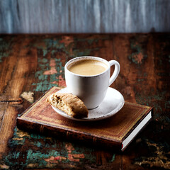 Cup of coffee and Cantuccini (Italian cookie) on dark wooden background. Copy space.	