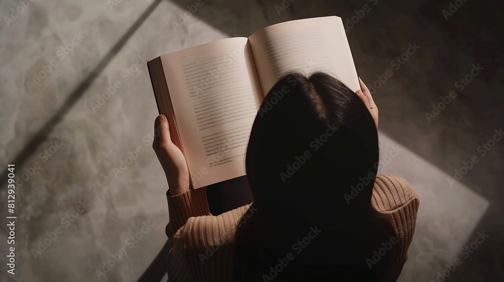 Aufkleber top view of a woman reading an open book or magazine empty page mock up : Generative AI