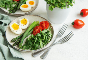 Fresh Spring Salad With Boiled Eggs, Asparagus, and Tomatoes on a Bright Day